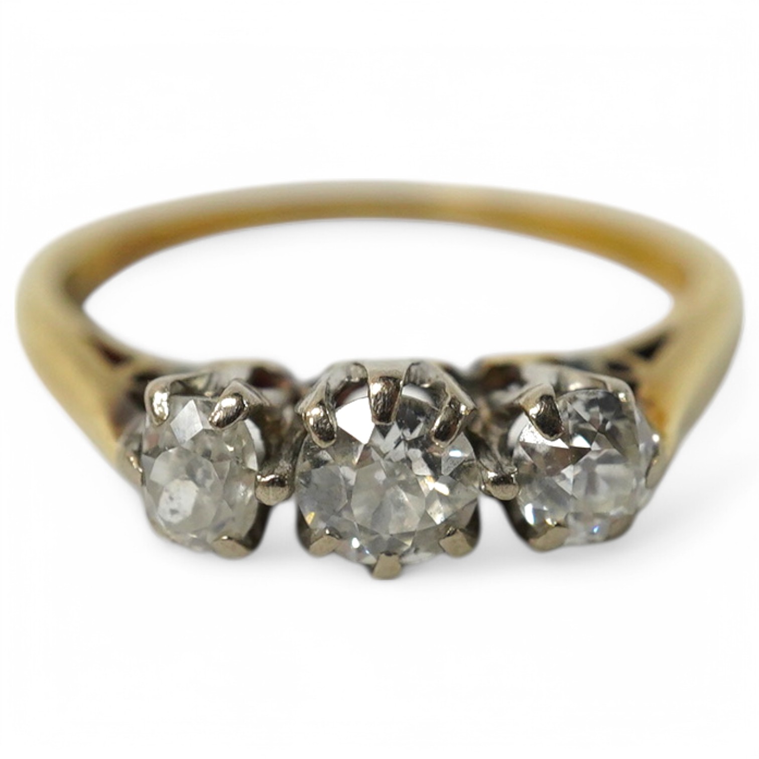 An 18ct gold and three stone diamond set ring, size K, gross weight 2.4 grams. Condition - fair to good